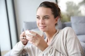 Woman holding a cup of coffee